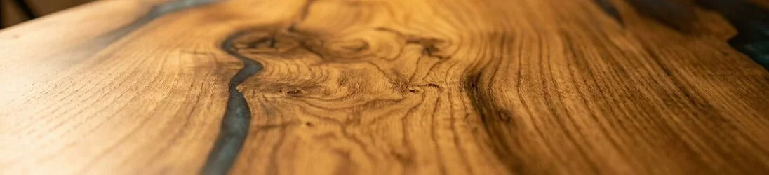 Elm wood epoxy dining table showing unique grain character and natural variation