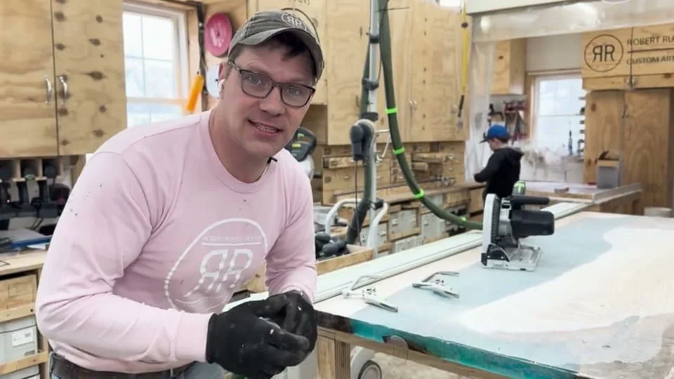 Still from the film “A semi-transparent epoxy waterfall table”.