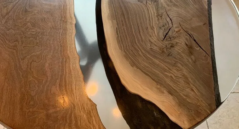 Top Image of clear epoxy resin table with Walnut