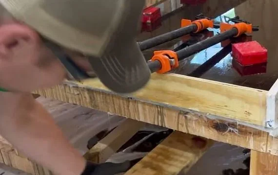 Still from the film “Making a walnut and epoxy resin table, start to finish”.